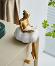 Load image into Gallery viewer, Sophie Cloud Girl Sculptures by Allthingscurated feature 2 beautiful lady statues in 2 postures—reading and pondering. Adorned with a classic ballerina bun and dressed in a minimalistic dress that ends with a voluminous skirt reminiscent of fluffy clouds. These sculptures bring a touch of serenity and sophistication to your living space.