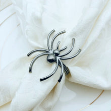 Load image into Gallery viewer, Spider Napkin Rings set of 6 by Allthingscurated spots a stylish and modern design that is perfect for decorating your table for Halloween or any gothic-themed event. Comes in 4 captivating colors of black, gunmetal, champagne gold and silver, these accessories will dress up your napkins and add a touch of edgy elegance to your dining experience.