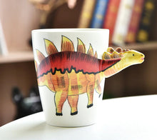 Load image into Gallery viewer, 3D Dinosaur Mug Collection by Allthingscurated consists of 8 unique dinosaur designs with each mug holding a generous capacity of 400ml or 13.5 ounce. Made of high-quality porcelain, they are the perfect gift for dinosaur lovers. The design seen here is Stegosaurus.