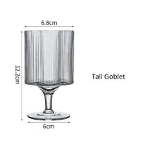 Load image into Gallery viewer, Florentina Drinkware by Allthingscurated embraces a modern design featuring sleek fluted lines with a unique shape reminiscent of a peach blossom flower. Stylish and chic, this collection includes a carafe, goblets and several tumblers, including a glamorous coupe cocktail glass. Add elegance to everyday use with this beautiful collection and just as perfect for setting an extravagant holiday table. Seen here is a Tall Goblet.