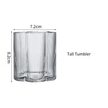 Load image into Gallery viewer, Florentina Drinkware by Allthingscurated embraces a modern design featuring sleek fluted lines with a unique shape reminiscent of a peach blossom flower. Stylish and chic, this collection includes a carafe, goblets and several tumblers, including a glamorous coupe cocktail glass. Add elegance to everyday use with this beautiful collection and just as perfect for setting an extravagant holiday table. Seen here is a Tall Tumbler.