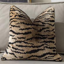 Load image into Gallery viewer, Glamorous Animal Prints Cushion Covers by Allthingscurated featured 6 animal print designs in tiger stripes, cheetah spots, zebra stripes and giraffe print. In a neutral palette and warm texture that work well with a variety of decorating styles. Timeless and chic, they are the perfect accessories to dress up with home with a wow factor. Comes in 2 square sizes of 45 by 45cm or 17.5 by 17.5 inches or 50 by 50cm or 19.5 by 19.5 inches. Featured here is our tiger print in brown.