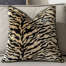 Load image into Gallery viewer, Glamorous Animal Prints Cushion Covers by Allthingscurated featured 6 animal print designs in tiger stripes, cheetah spots, zebra stripes and giraffe print. In a neutral palette and warm texture that work well with a variety of decorating styles. Timeless and chic, they are the perfect accessories to dress up with home with a wow factor. Comes in 2 square sizes of 45 by 45cm or 17.5 by 17.5 inches or 50 by 50cm or 19.5 by 19.5 inches. Featured here is our tiger print in light tan.