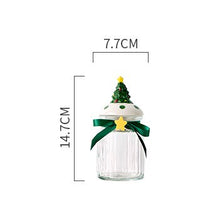 Load image into Gallery viewer, Christmas Festive Storage Jars by Allthingscurated are the perfect jars to keep all your festive treats fresh and delicious. The jars are airtight and each jar is topped with a ceramic lid decorated with a Santa Claus, Christmas Tree, Penguin, Gnome or Fox. Comes in 2 sizes with capacity of 300ml or 10 ounce and 1000ml or 34 ounce. Featured here is a small Christmas Tree jar.