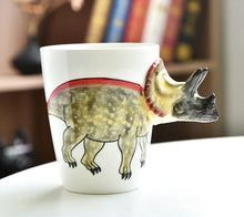 Load image into Gallery viewer, 3D Dinosaur Mug Collection by Allthingscurated consists of 8 unique dinosaur designs with each mug holding a generous capacity of 400ml or 13.5 ounce. Made of high-quality porcelain, they are the perfect gift for dinosaur lovers. The design seen here is Triceratops.