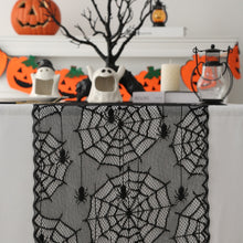 Load image into Gallery viewer, Black Lace Spider Web Table Runner by Allthingscurated. This stunning Black Spider Web Table Runner designed in elegant black lace featuring spiders and cobweb embroidery will make a bold statement for your Halloween table setting. Shown here is the design with spiders and cobwebs embriodery.