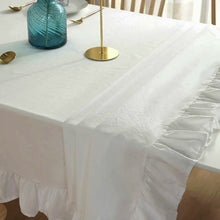 Load image into Gallery viewer, Introducing Ruffled Cotton Tablecloth by Allthingscurated. Made from 100% cotton, our tablecloth exudes French country charm with its romantic, frilly ruffles. With the perfect balance of decorative and laid-back, they have a welcoming and comforting vibe. Available in 8 solid colors.
