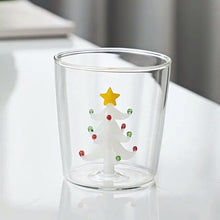 Load image into Gallery viewer, Christmas Tree Drinking Glass by Allthingscurated has a playful and whimsical design, featuring a sculptural 3D Christmas Tree within the tumbler. The tree comes in a 2 colors, green and white. Measuring 8.5cm or 3.3 inches in width at the top, 9cm or 3.5 inches in height and 6.5cm or 2.5 inches in width at the base, the drinking glass has a capacity of 300ml or 10 ounce. Featured here is one with a white Christmas Tree.