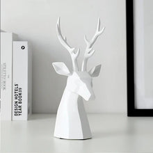 Load image into Gallery viewer, This beautiful Deer Head Bust sculpture is made of resin and comes available in 4 colors of black, white, gray and teal. Measuring 26cm or 10 inches in height and 11.5cm or 4.5 inches in width. This figurine spots a contemporary design with sculptural form inspired by Origami. This decorative piece will add timeless elegance to your space year-round. Perfect for festive tablescapes, mantels and shelves. This is a deer head bust in White.