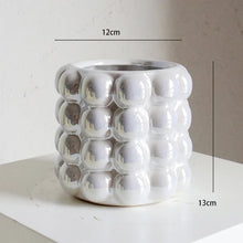 Load image into Gallery viewer, Zayla Bubble Planters by Allthingscurated are made from ceramic. These planters feature a chic design with striking 3D bubble exterior that looks sophisticated and will transform the look of your beloved indoor plants effortlessly. Come in 2 sizes and available in 3 colors that will complement any modern home décor styles. Featured here is the large white planter.