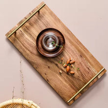 Load image into Gallery viewer, Wooden Serving Tray by Allthingscurated is designed with versatility and organic beauty in mind. Crafted from natural wood and accented with gold hardware handles for easy transportation and handling, these wooden trays serve up your sliced breads, cheeses and drinks in style. With 3 size options, they are ideal for hosting and a nice presentation with a natural touch to your table.