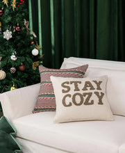 Load image into Gallery viewer, Decorative pillows on a couch with a Christmas tree in the background. Elevate your seasonal décor with this curated selection of holiday Decorative Christmas Pillows and Covers Collection by Allthingscurated. Sewn from quality, soft fabrics with thoughtful tufted details, each piece delivers both comfort and visual appeal to your home.