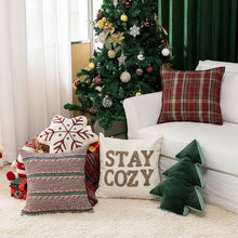 Load image into Gallery viewer, Decorative pillows on a couch with a Christmas tree in the background. Elevate your seasonal décor with this curated selection of holiday Decorative Christmas Pillows and Covers Collection by Allthingscurated. Sewn from quality, soft fabrics with thoughtful tufted details, each piece delivers both comfort and visual appeal to your home.