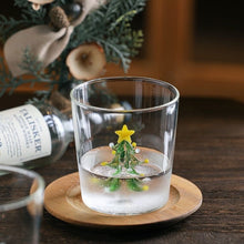 Load image into Gallery viewer, Christmas Tree Drinking Glass by Allthingscurated has a playful and whimsical design, featuring a sculptural 3D Christmas Tree within the tumbler. The tree comes in a 2 colors, green and white. Measuring 8.5cm or 3.3 inches in width at the top, 9cm or 3.5 inches in height and 6.5cm or 2.5 inches in width at the base, the drinking glass has a capacity of 300ml or 10 ounce.