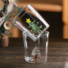 Load image into Gallery viewer, Christmas Tree Drinking Glass by Allthingscurated has a playful and whimsical design, featuring a sculptural 3D Christmas Tree within the tumbler. The tree comes in a 2 colors, green and white. Measuring 8.5cm or 3.3 inches in width at the top, 9cm or 3.5 inches in height and 6.5cm or 2.5 inches in width at the base, the drinking glass has a capacity of 300ml or 10 ounce.