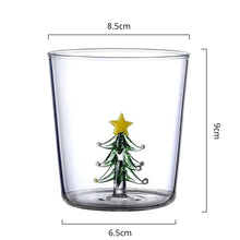 Load image into Gallery viewer, Christmas Tree Drinking Glass by Allthingscurated has a playful and whimsical design, featuring a sculptural 3D Christmas Tree within the tumbler. The tree comes in a 2 colors, green and white. Measuring 8.5cm or 3.3 inches in width at the top, 9cm or 3.5 inches in height and 6.5cm or 2.5 inches in width at the base, the drinking glass has a capacity of 300ml or 10 ounce.