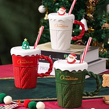 Load image into Gallery viewer, Snow Capped Christmas Gift Mug by Allthingscurated boasts festive colors of red, green and white, featuring a Merry Christmas greeting engraved on the mug. The elegant mug is crafted from ceramic with a snow-like lid and a charming Christmas relief pattern, making it the perfect gift for your friends and colleagues during office parties. Comes with a straw for added convenience.