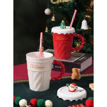Load image into Gallery viewer, Snow Capped Christmas Gift Mug by Allthingscurated boasts festive colors of red, green and white, featuring a Merry Christmas greeting engraved on the mug. The elegant mug is crafted from ceramic with a snow-like lid and a charming Christmas relief pattern, making it the perfect gift for your friends and colleagues during office parties. Comes with a straw for added convenience.