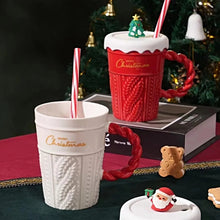 Load image into Gallery viewer, Snow Capped Christmas Gift Mug by Allthingscurated boasts festive colors of red, green and white, featuring a Merry Christmas greeting engraved on the mug. The elegant mug is crafted from ceramic with a snow-like lid and a charming Christmas relief pattern, making it the perfect gift for your friends and colleagues during office parties. Comes with a straw for added convenience.