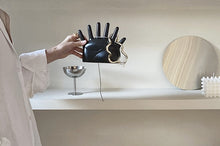 Load image into Gallery viewer, This abstract, one-of-a-kind contemporary jewelry holder by Allthingscurated is designed as an upright-standing palm with 6 fingers for slotting your favorite rings, bracelets or bangles. Made of ceramic and available in silver and black. It measures 19cm or 7.4 inches in width, 16cm or 6.2 inches in height and 14.5cm or 5.7 inches in depth.