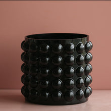 Load image into Gallery viewer, Zayla Bubble Vase by Allthingscurated features a geometric bubble design. The eye-catching detail and design are enough to make it a statement centerpiece with or without floral display. Comes in black or clear and in 2 sizes. The short vase measures 17cm or 6.6 inches in height and 16cm or 6.2 inches in diameter. The tall vase measures 27.5cm or 10.7 inches in height and 13cm or 5 inches in diameter. This is a pair of clear vases with small pink flowers in the tall vase. This is a short black vase.