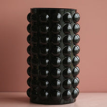Load image into Gallery viewer, Zayla Bubble Vase by Allthingscurated features a geometric bubble design. The eye-catching detail and design are enough to make it a statement centerpiece with or without floral display. Comes in black or clear and in 2 sizes. The short vase measures 17cm or 6.6 inches in height and 16cm or 6.2 inches in diameter. The tall vase measures 27.5cm or 10.7 inches in height and 13cm or 5 inches in diameter. This is a pair of clear vases with small pink flowers in the tall vase. This is a tall black vase.