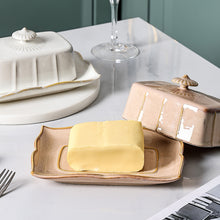 Load image into Gallery viewer, Retro-style Porcelain Butter Dish by Allthingscurated comes in 2 muted tones of Antique White and Antique Peach. A butter dish that comes with a cover with beautiful patterns, it is an ideal and practical storage for your butter. Measures 19.3cm or 7.5 inches in width, 9cm or 3.5 inches in height and 14.2cm or 5.5 inches in depth.
