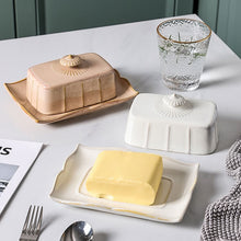 Load image into Gallery viewer, Retro-style Porcelain Butter Dish by Allthingscurated comes in 2 muted tones of Antique White and Antique Peach. A butter dish that comes with a cover with beautiful patterns, it is an ideal and practical storage for your butter. Measures 19.3cm or 7.5 inches in width, 9cm or 3.5 inches in height and 14.2cm or 5.5 inches in depth.