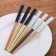Load image into Gallery viewer, These Chinese chopsticks by Allthingscurated is contemporary with a square design for better food gripping. Made of 304 food grade stainless steel, they come in 6 different color combinations of Black and Gold, Black and Rose Gold, Black and Silver, White and Black, White and Gold, White and Rose Gold. Retailed as a set of 6 pairs, choose from one of the above color combinations or opt for an assorted set of 6 different color combinations. Chopstick length is 23.5cm or 9 inches.