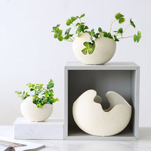 Load image into Gallery viewer, Egg Shell Decorative Pots by Allthingscurated spot an unconventional, egg shape design that looks aesthetically beautiful on its own as an ornamental piece, or full of character as a plant pot for your favorite botanicals. Made of ceramic and comes in 3 different sizes.