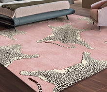 Load image into Gallery viewer, Blush Leopard Area Rug by Allthingscurated features a striking design of multiple patterns of leopard sets against a blushing pink color that blends easily into any décor styles. The rectangle rug comes available in 7 sizes.
