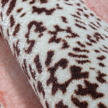 Load image into Gallery viewer, Blush Leopard Area Rug by Allthingscurated features a striking design of multiple patterns of leopard sets against a blushing pink color that blends easily into any décor styles. The rectangle rug comes available in 7 sizes.