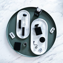 Load image into Gallery viewer, Allthingscurated Marble Design Oval Ceramic Trays in White with subtle marble veining. These trays can be used for serving and decorative purposes. Available in Small and Large size. Large tray measuring 32 by 15 centimeters or 12.5 by 5.9 inches. Small tray measures 25.5 by 11.8 centimeters or 10 by 4.6 inches.