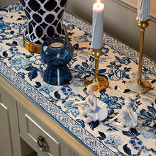Load image into Gallery viewer, Porcelain Blue Table Runner by Allthingscurated features detailed designs of florals and birds in blue and printed on white background, inspired by the ancient Chinese Porcelain. A fusion of the east and west— this CHINOISERIE style is contemporary, CHARMING and TIMELESS. We added generous tassels in two shades of blues for a striking contrast. Made of cotton-linen blend with 6 sizes available.