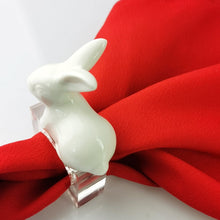 Load image into Gallery viewer, Porcelain Rabbit Napkin Holder by Allthingscurated comes as a set of 4 holders. Made of white porcelain for the rabbit which sits atop the high-quality acrylic holder. Perfect for Easter.