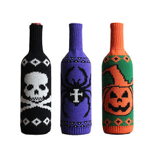 Load image into Gallery viewer, Halloween Knitted Wine Bottle Sleeves by Allthingscurated come in 3 trendy design of a skull, spider and pumpkin. They are are great way to dress up your wine bottles for quick Halloween makeover for your home and dining table. Featured here is a set of 3 designs.