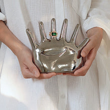 Load image into Gallery viewer, This abstract, one-of-a-kind contemporary jewelry holder by Allthingscurated is designed as an upright-standing palm with 6 fingers for slotting your favorite rings, bracelets or bangles. Made of ceramic and available in silver and black. It measures 19cm or 7.4 inches in width, 16cm or 6.2 inches in height and 14.5cm or 5.7 inches in depth.