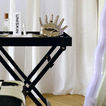 Load image into Gallery viewer, This abstract, one-of-a-kind contemporary jewelry holder by Allthingscurated is designed as an upright-standing palm with 6 fingers for slotting your favorite rings, bracelets or bangles. Made of ceramic and available in silver and black. It measures 19cm or 7.4 inches in width, 16cm or 6.2 inches in height and 14.5cm or 5.7 inches in depth.