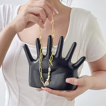 Load image into Gallery viewer, This abstract, one-of-a-kind contemporary jewelry holder by Allthingscurated is designed as an upright-standing palm with 6 fingers for slotting your favorite rings, bracelets or bangles. Made of ceramic and available in silver and black. It measures 19cm or 7.4 inches in width, 16cm or 6.2 inches in height and 14.5cm or 5.7 inches in depth.