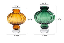 Load image into Gallery viewer, Luna Lantern Vases by Allthingscurated are stylish and versatile. Crafted from high-quality thick glass and creatively shaped like an Oriental Lantern with a strong aesthetic, they are perfect for creative floral arrangement or simply as a decorative display on its own. Comes in 2 sizes and 3 avaliable colors of green, gray and amber.