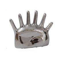 Load image into Gallery viewer, This abstract, one-of-a-kind contemporary jewelry holder by Allthingscurated is designed as an upright-standing palm with 6 fingers for slotting your favorite rings, bracelets or bangles. Made of ceramic and available in silver and black. It measures 19cm or 7.4 inches in width, 16cm or 6.2 inches in height and 14.5cm or 5.7 inches in depth. This one is silver in color.