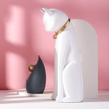 Load image into Gallery viewer, White cat and grey mouse looking into each other peacefully with a lovely pink background.
