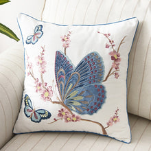 Load image into Gallery viewer, Allthingscurated Spring Harmony Cushion Cover Collection in garden-inspired theme featuring butterflies, florals and birds in embroidering in 100% cotton fabric. Measuring 45 x 45cm or 18 x 18 inches. Available in 7 designs. Shown here, butterflies in blue and mauve Design C.