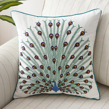 Load image into Gallery viewer, Allthingscurated Spring Harmony Cushion Cover Collection in garden-inspired theme featuring butterflies, florals and birds in embroidering in 100% cotton fabric. Measuring 45 x 45cm or 18 x 18 inches. Available in 7 designs. Shown here peacocok in fully open feather Design G.
