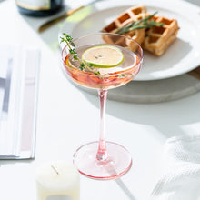 Load image into Gallery viewer, Allthingscurated Alaia Pink gold-rimmed champagne Coupe with a capacity of 140ml or 4.7 fluid ounce. Made of lead-free crystal glass
