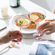 Load image into Gallery viewer, Allthingscurated Alaia Pink gold-rimmed champagne Coupe with a capacity of 140ml or 4.7 fluid ounce. Made of lead-free crystal glass