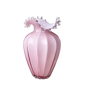 Anais Pink Beaded Vases by Allthingscurated are crafted from handblown glasses. Featuring a curvaceous body with an asymmetrical beaded rim that flares back like a collar.  Its captivating shape and romantic pink hue makes it a statement piece and a glamorous addition to your vase collection. Available in small and large size.