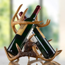 Load image into Gallery viewer, Antler Wine Bottle Holder by Allthingscurated is hand-crafted from resin and hand-painted to emulate the look of genuine antlers. Beautiful and sculptural, it’s a great gift for any occasion as well as a perfect addition to give your winter tablescape a cabin vibe.  On its own, it’s a decorative, ornamental piece that gives a luxurious look to your mantel, tabletop or shelf.  Measuring approximately 33cm or 13 inches in height, 35cm or 13.7 inches wide and a depth of 23cm or 9 inches.
