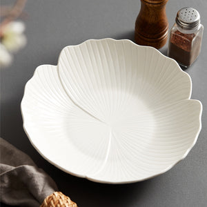 Audri Flower Serving Bowl by Allthingscurated featured a distinct flower design with petal edges and vivid texture surface in neutral white.  The low bowl design comes in 3 sizes.