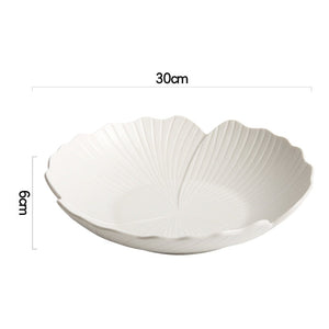 Audri Flower Serving Bowl by Allthingscurated featured a distinct flower design with petal edges and vivid texture surface in neutral white.  The low bowl design comes in 3 sizes.  Featured here is a large size measuring 30cm or 11.7 inches in width and 6cm or 2.3 inches in height.